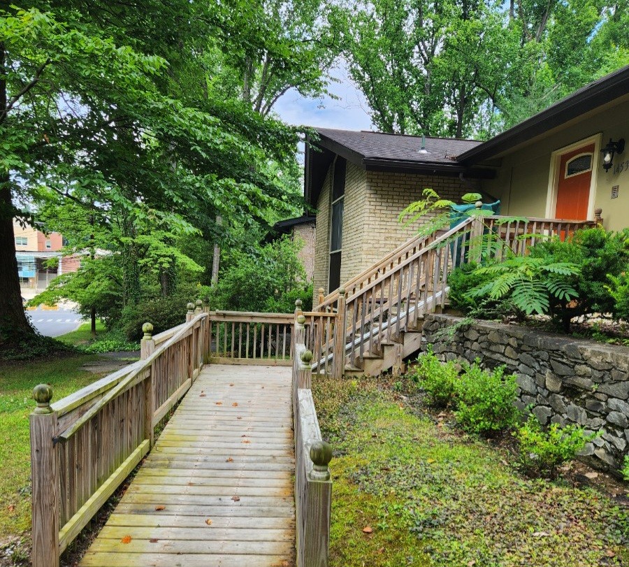 Wooden walkway leading from the garden to the house entrance